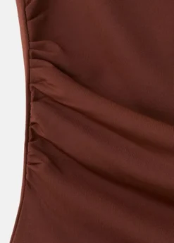 Asymmetric appliqué top