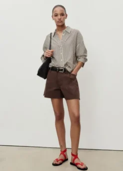 Denim shorts with frayed hem and pl