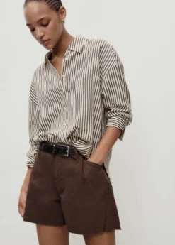 Denim shorts with frayed hem and pl