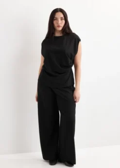 Straight-fit trousers with elastic