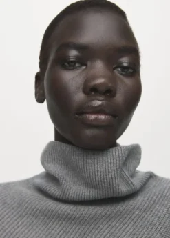 Sweater with asymmetrical roll neck