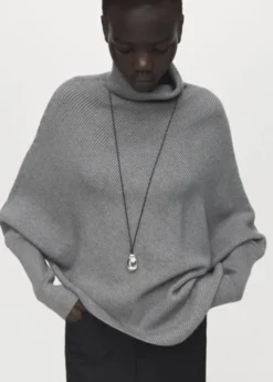 Sweater with asymmetrical roll neck