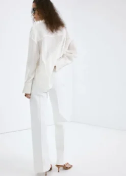Wide-leg jeans with side buttons